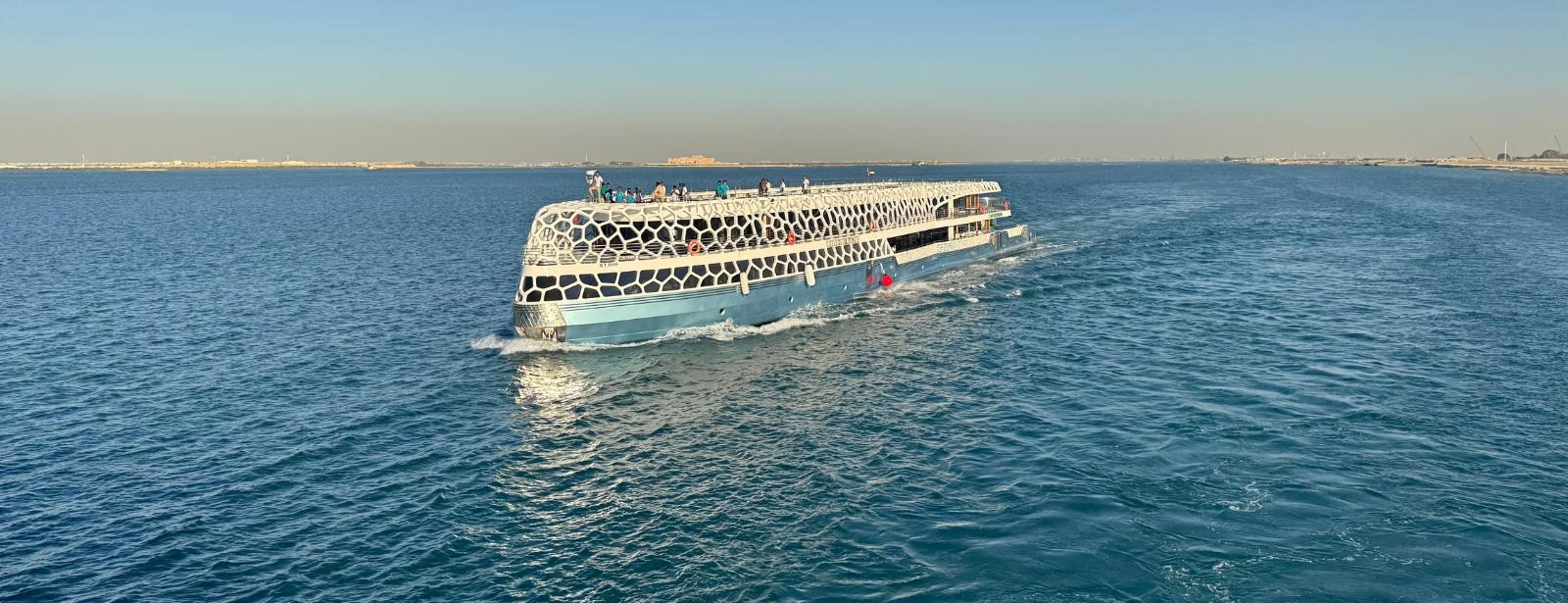 Luxury Lotus 220ft yacht cruising past Palm Jumeirah Dubai