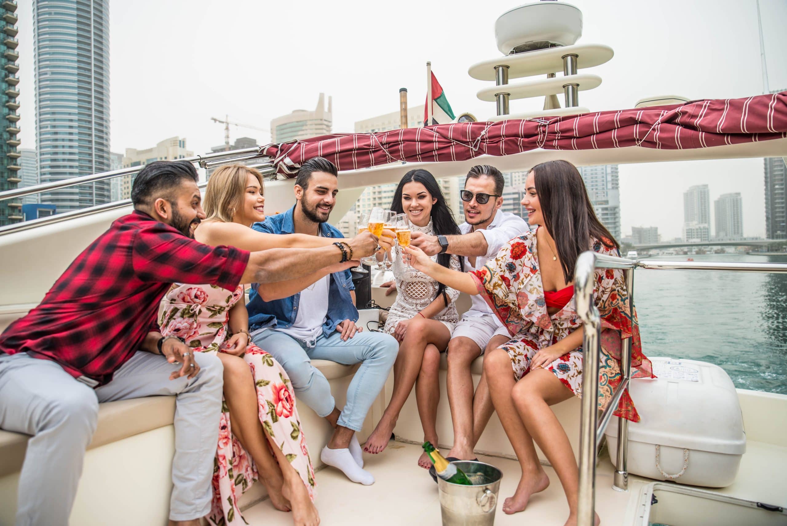 Guests enjoying a shared yacht party in Dubai Marina