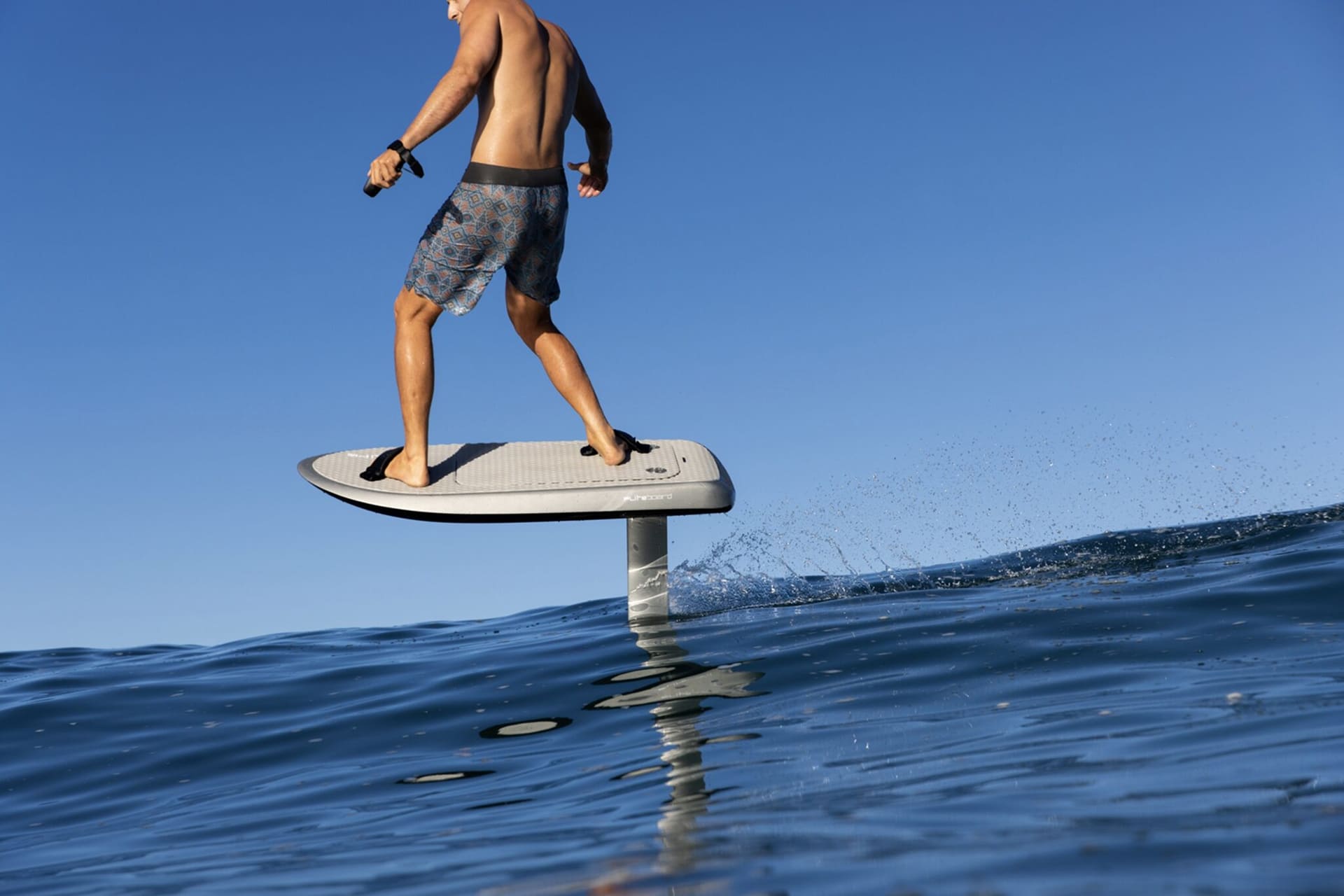 Beginner learning e-foil water sports in Dubai Marina